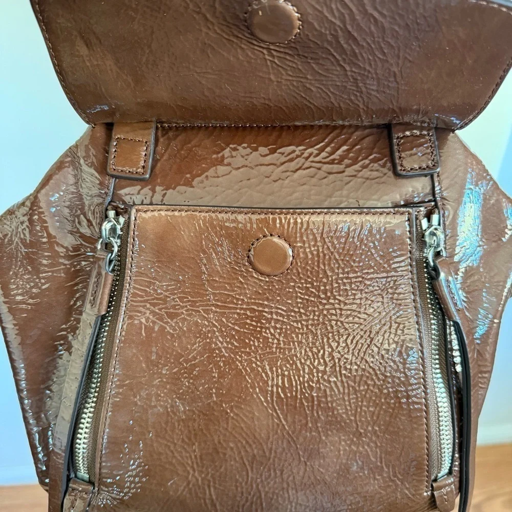 Tory Burch half moon patent leather brown purse with crossbody strap